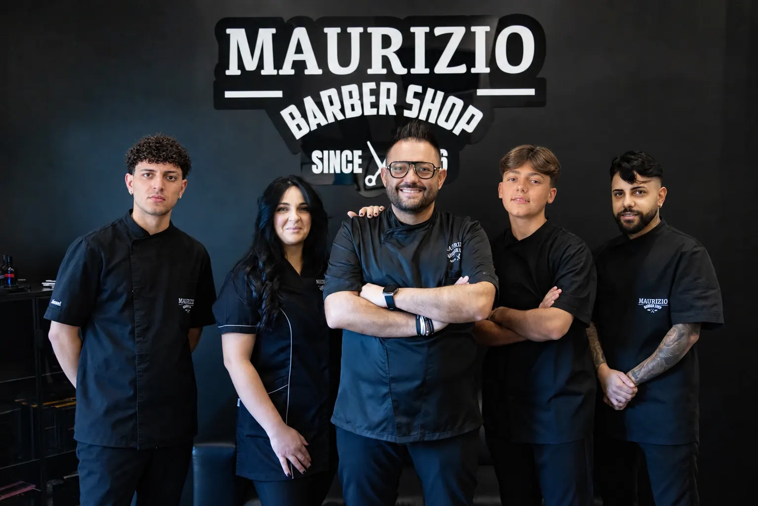 The team in front of the logo: Manuel, Michela, Maurizio, Claudio and Gino